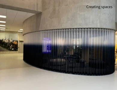 Full height curtains creating flexible spaces in a commercial interior